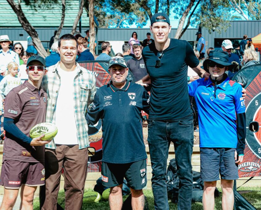 Jack Silvagni and Mason Cox with 3 members of Blind Sports.