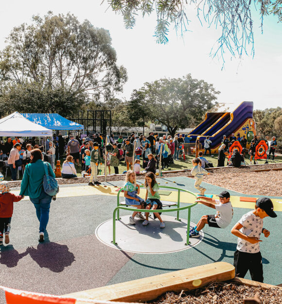 Children playing in playground during Guide Dogs community fair