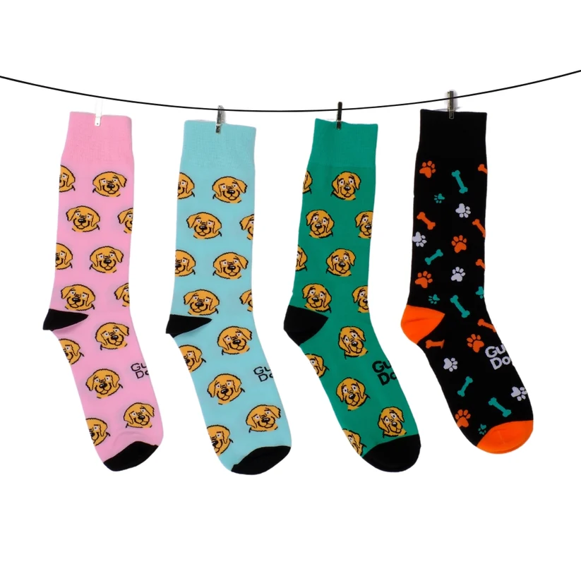 Various coloured Guide Dogs socks hanging on a clothes line