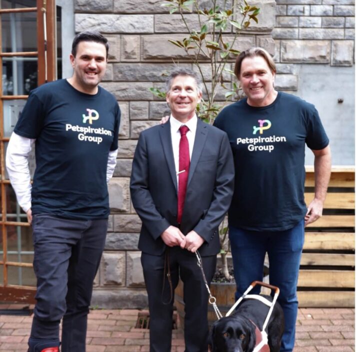 Iain Edwards, Interim CEO Guide Dogs Victoria, with Guide Dog Olympia thanking David and Shane Young and the Petspiration Team at a recent Roadshow