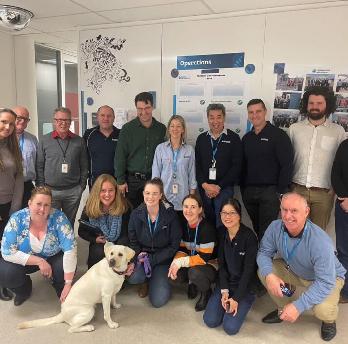 Piper during her AGIG visit, surrounded by the team