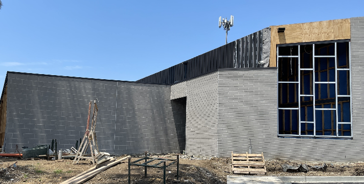 The residential wing with the bedroom window frames installed and timber lining surround completed on balcony walls and ceilings.