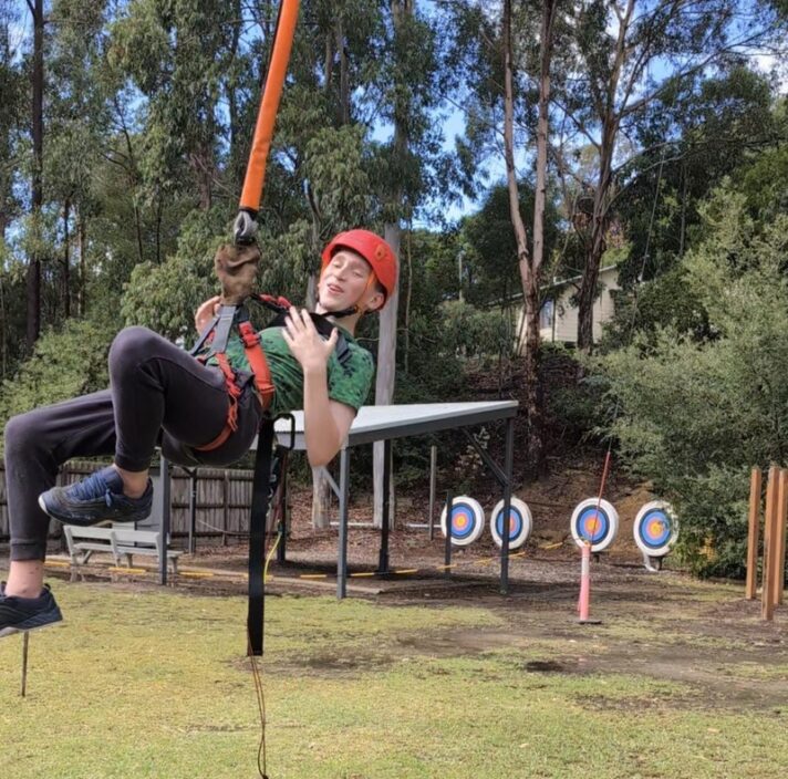 A boy is flying and foxing