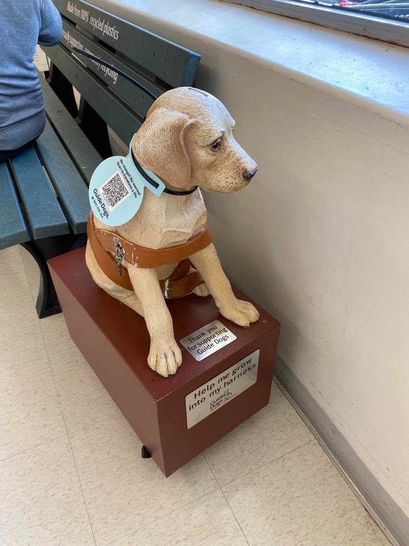 Statue of a Labrador with a QR code.