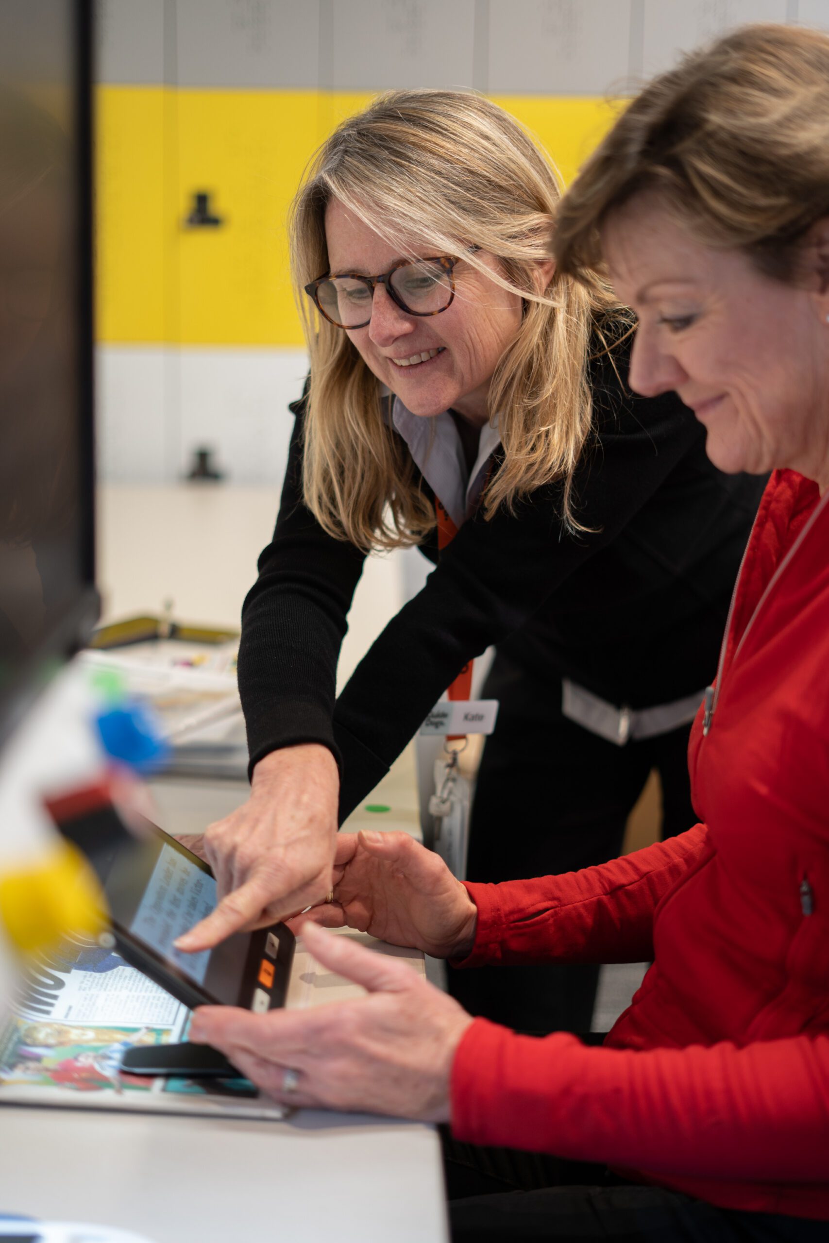 GDV Orthoptist Kate Clark demonstrating Orthoptic equipment with another GDV staff member.
