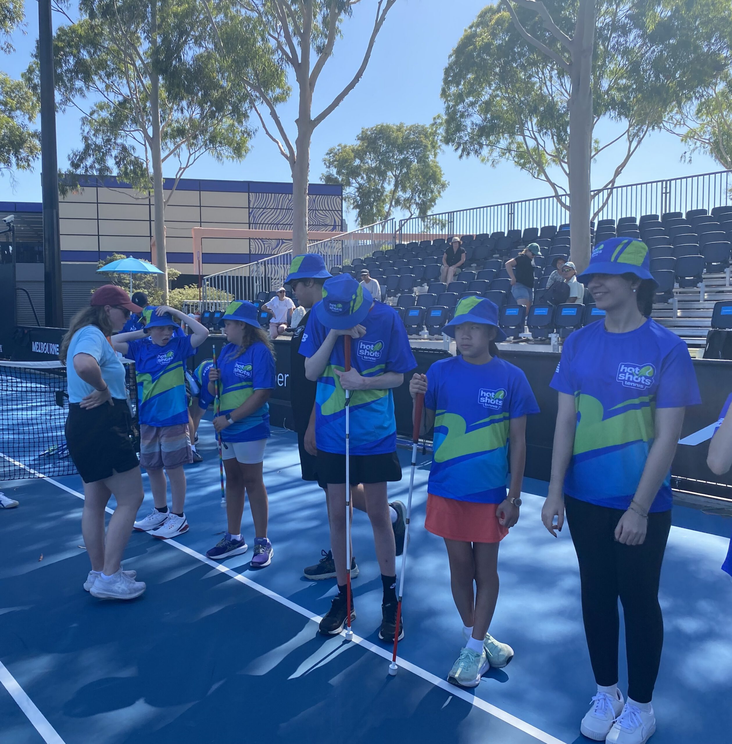Students line up on the serving line at court 5 at the Australian Open.