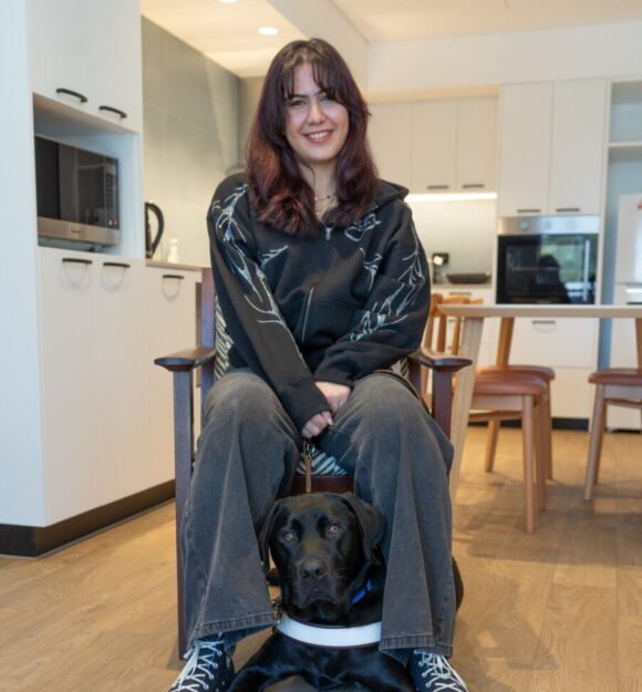 May sitting with her Guide Dog Gino