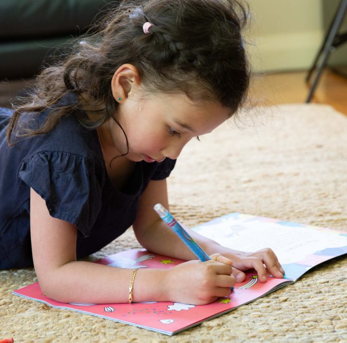 a girl is drawing
