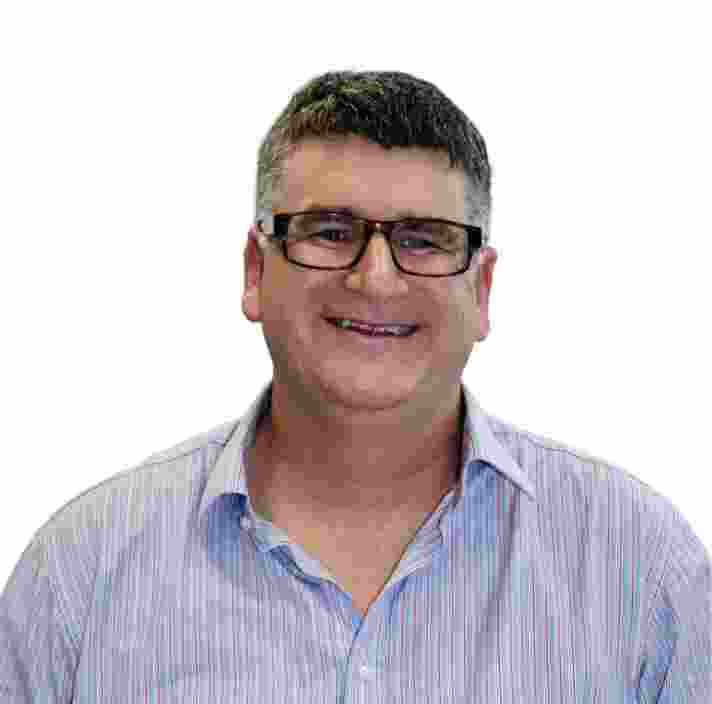 Headshot of Guide Dogs Victoria's Board Director, Anthony Kearns. Anthony is looking at the camera smiling.