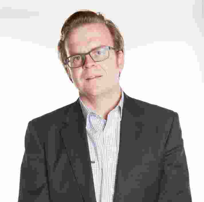 Headshot of Guide Dogs Victoria's Board Director, Charles Thompson. Charles is looking at the camera smiling.