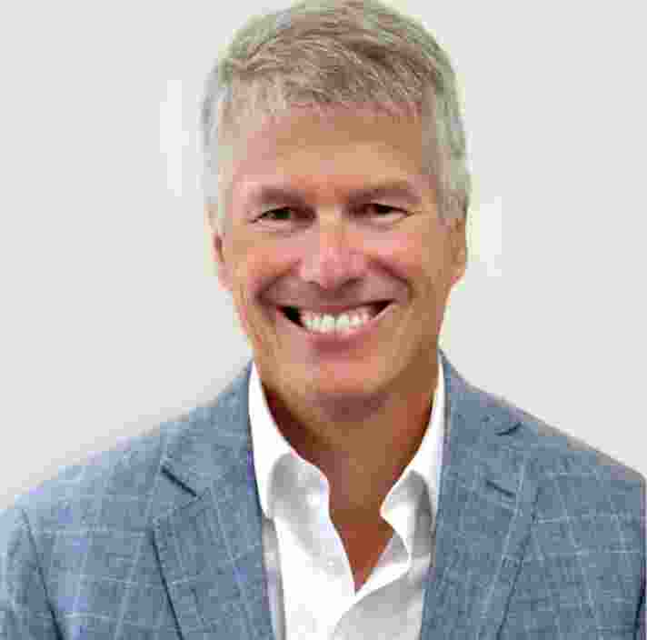 Headshot of Guide Dogs Victoria's Board Director, Nick Mescher. Nick is looking at the camera smiling.