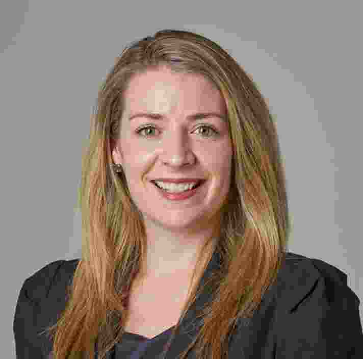 Headshot of Guide Dogs Victorias Executive to CEO, Hannah Dale. Hannah is looking at the camera smiling.