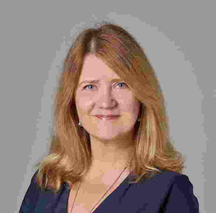 Headshot of Guide Dogs Victorias General Manager of Strategy and Business Improvement, Sophie Wild. Sophie is looking at the camera smiling.