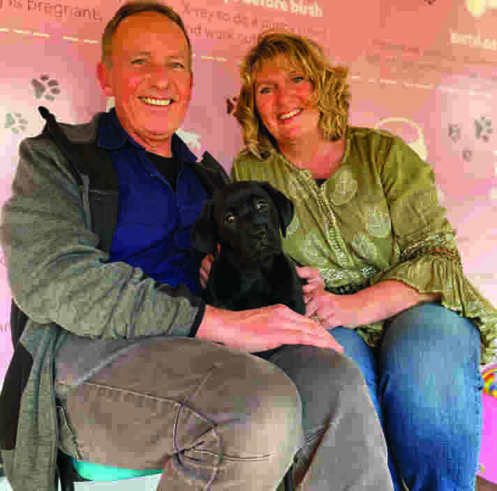 Rob and Carol with black labrador puppy Narla
