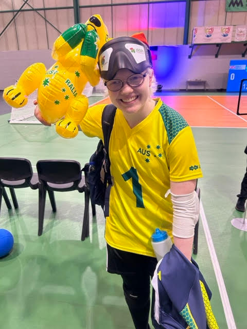 Client Zara in her yellow Australia jersey at the Goalball championships